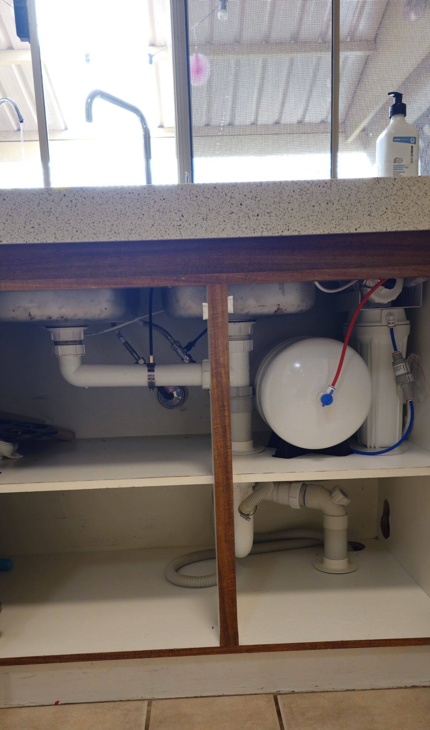 A reverse osmosis drinking water system installed under a sink