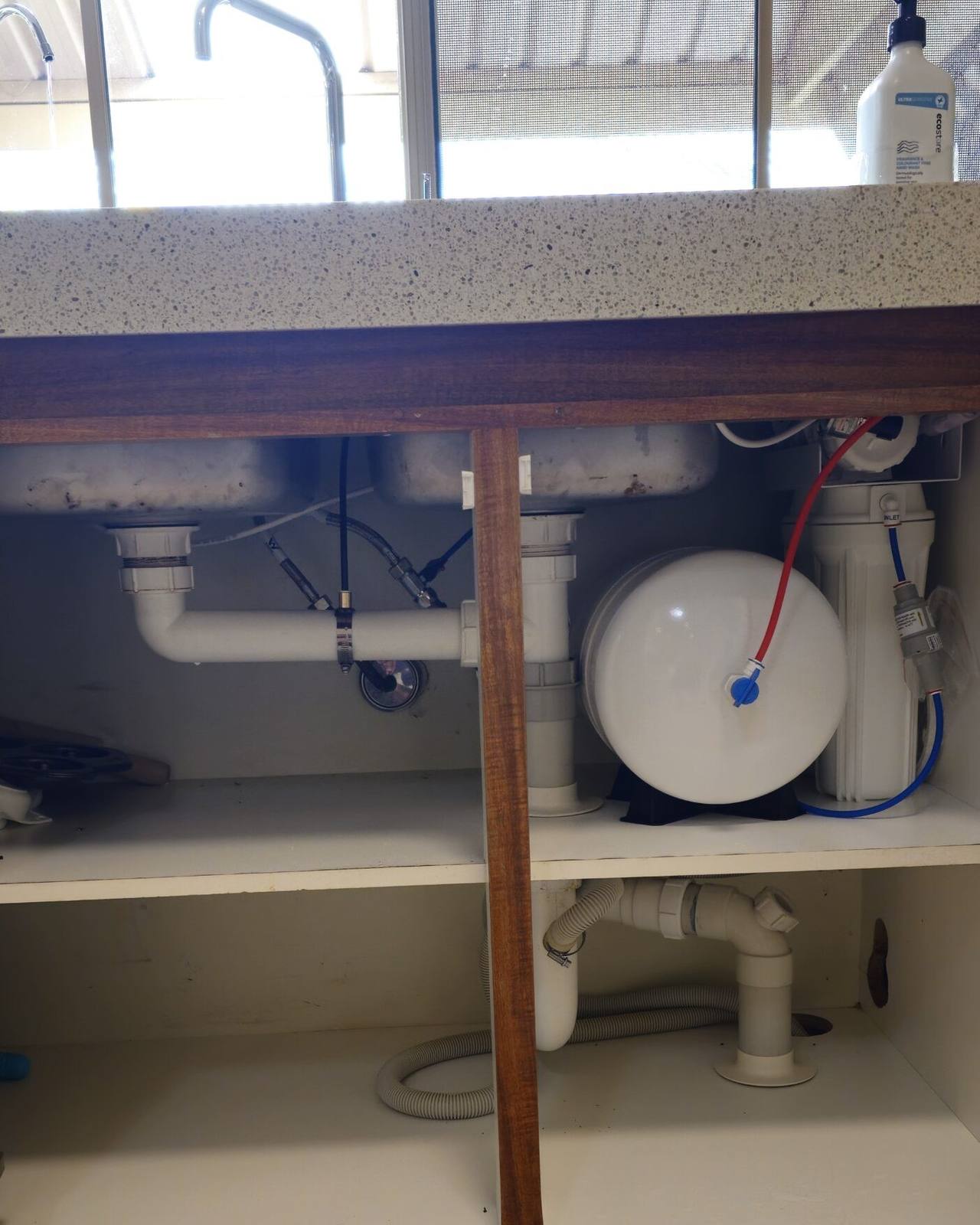 A reverse osmosis drinking water system installed under a sink